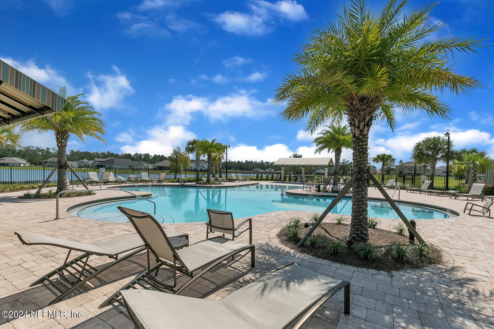 143 Willow Lake Drive St. Augustine, FL 32092 - Photo 39 of 45 a view of a swimming pool with a patio and a garden