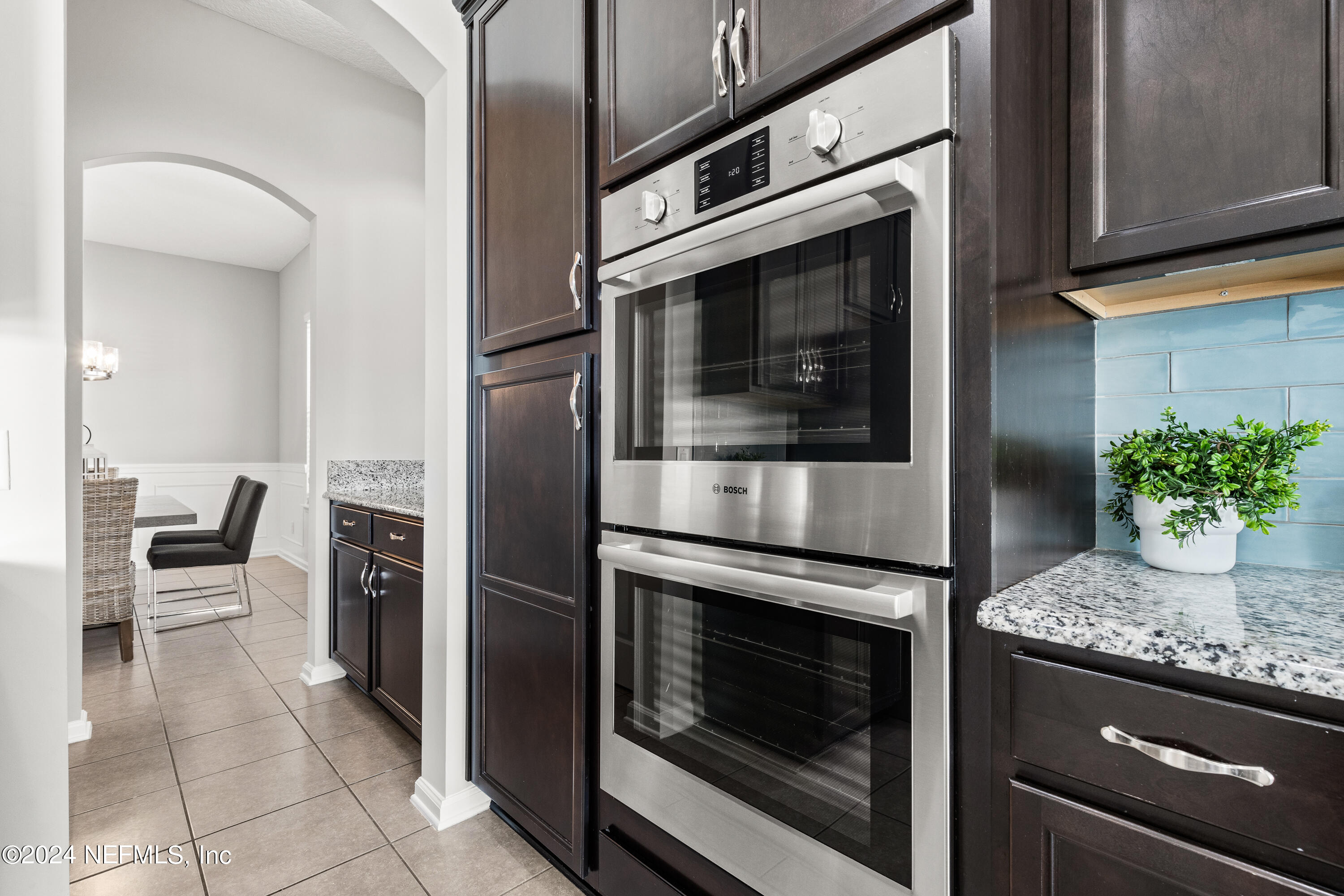 143 Willow Lake Drive St. Augustine, FL 32092 - Photo 7 of 45 a kitchen with granite countertop stainless steel appliances and counter space