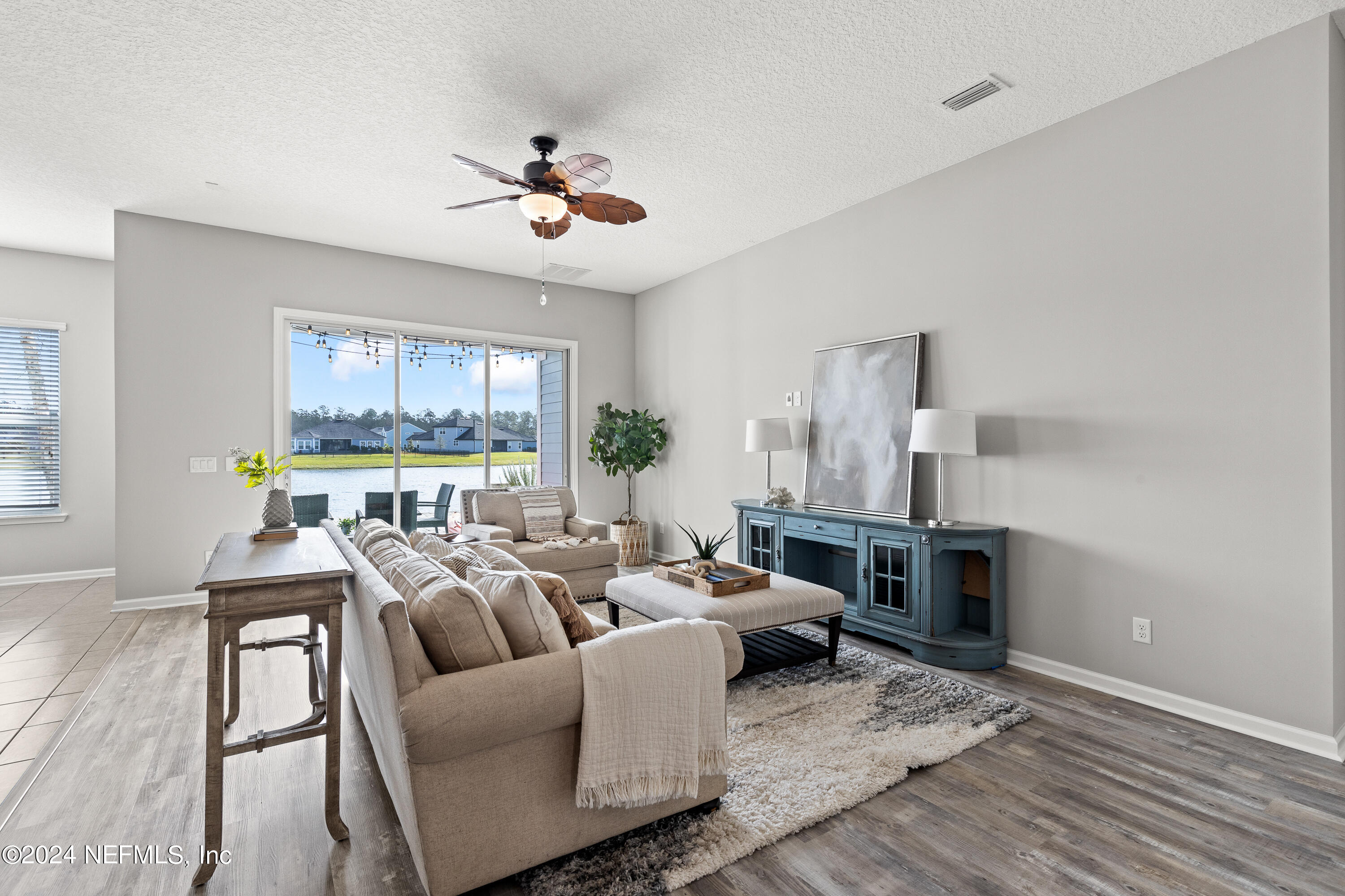 143 Willow Lake Drive St. Augustine, FL 32092 - Photo 10 of 45 a living room with furniture and a large window