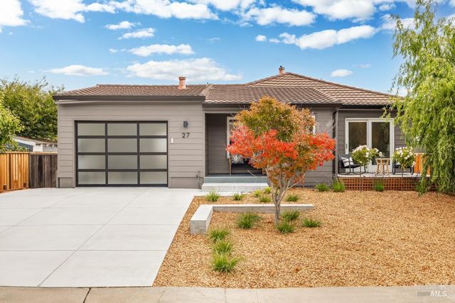 a front view of a house with yard