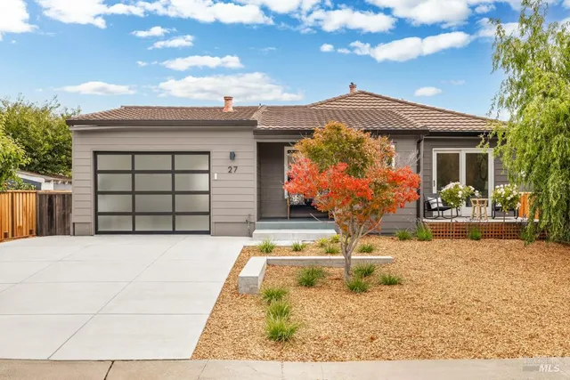 a front view of a house with yard