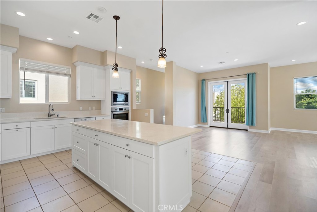 199 Follyhatch Irvine, CA 92618 - Photo 16 of 32 a view of a kitchen with a sink and a window