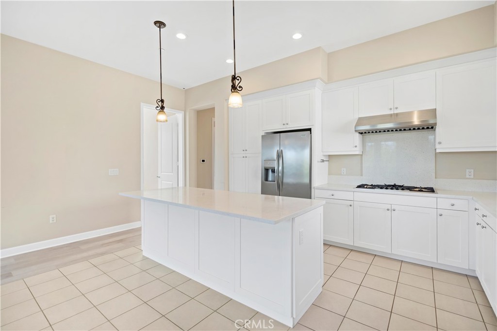 199 Follyhatch Irvine, CA 92618 - Photo 17 of 32 a kitchen with white cabinets and white appliances
