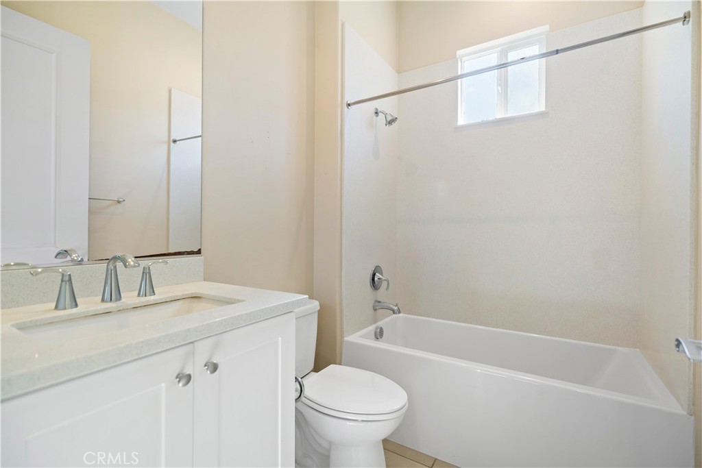 199 Follyhatch Irvine, CA 92618 - Photo 22 of 32 a bathroom with a sink toilet and shower