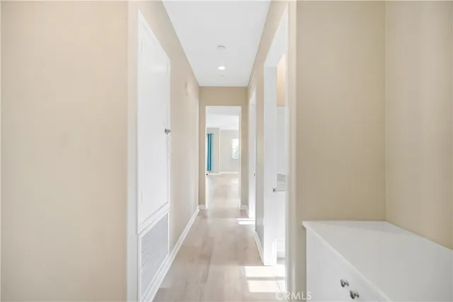 a view of a hallway with a white walls