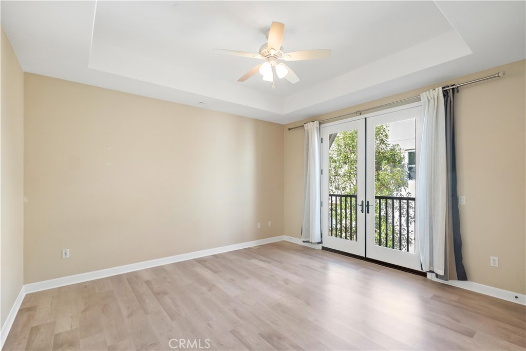 199 Follyhatch Irvine, CA 92618 - Photo 27 of 32 wooden floor in an empty room with a window