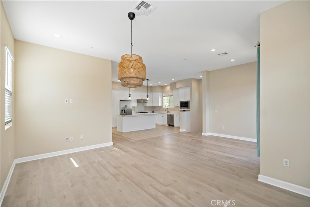 199 Follyhatch Irvine, CA 92618 - Photo 9 of 32 a view of a kitchen with a sink and dishwasher wooden floor
