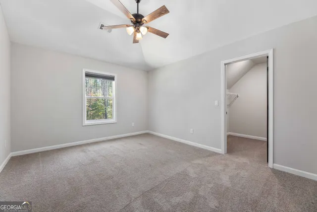 swimming pool view with a seating space