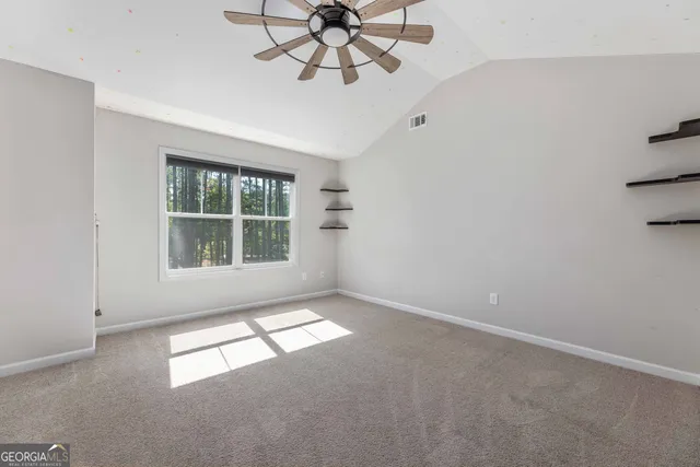 a view of a park with sitting area