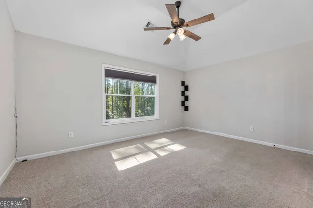 a view of a chairs and tables in the backyard