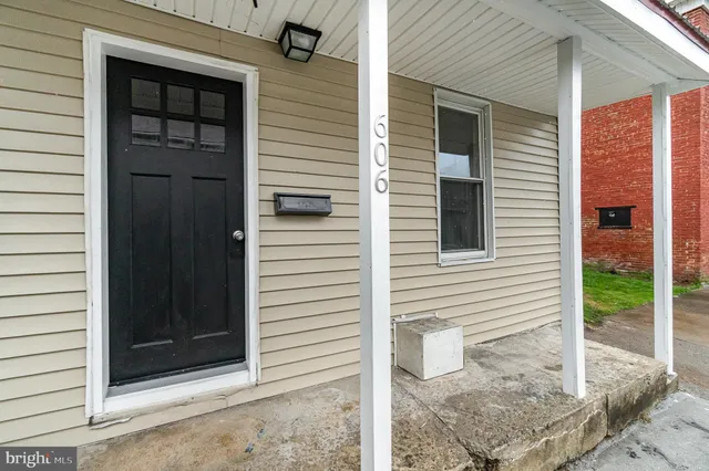 a view of a porch with a door and a large window