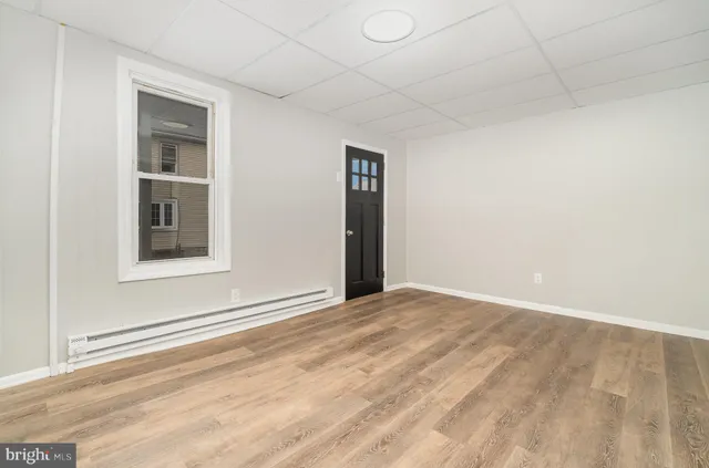 a view of an empty room with a window