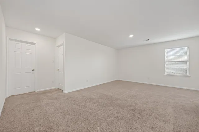 a bathroom with a sink a toilet a mirror a bathtub and shower