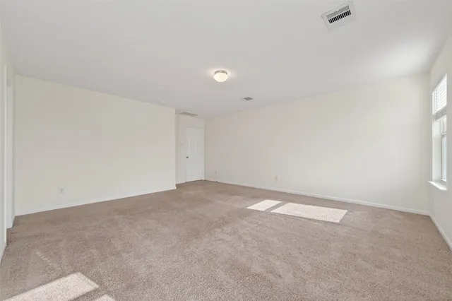 a spacious bathroom with a mirror a sink and bathtub