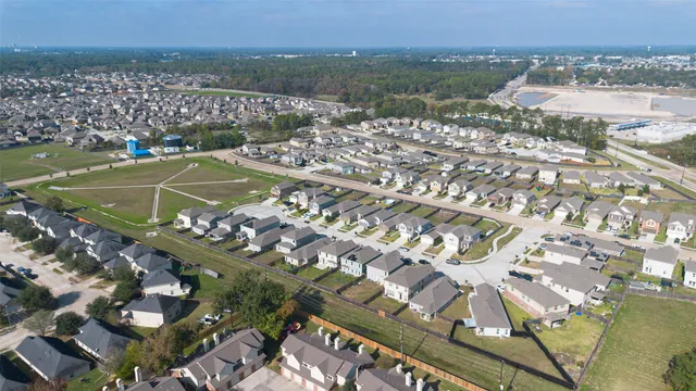 a front view of a house with a garden and plants