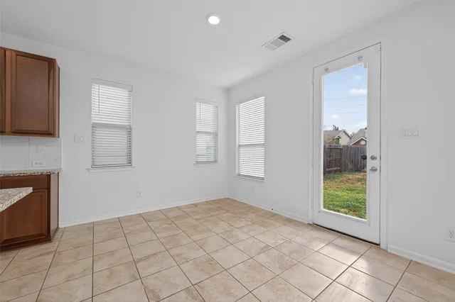a large kitchen with stainless steel appliances lots of counter top space