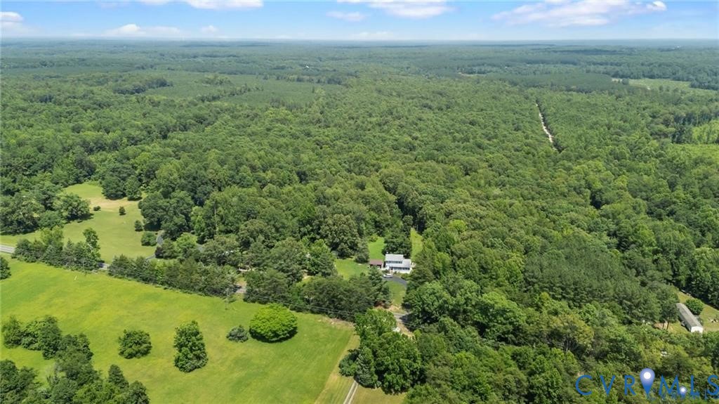 4668 Bell Road Powhatan, VA 23139 - Photo 9 of 11 a view of a green yard with an oven