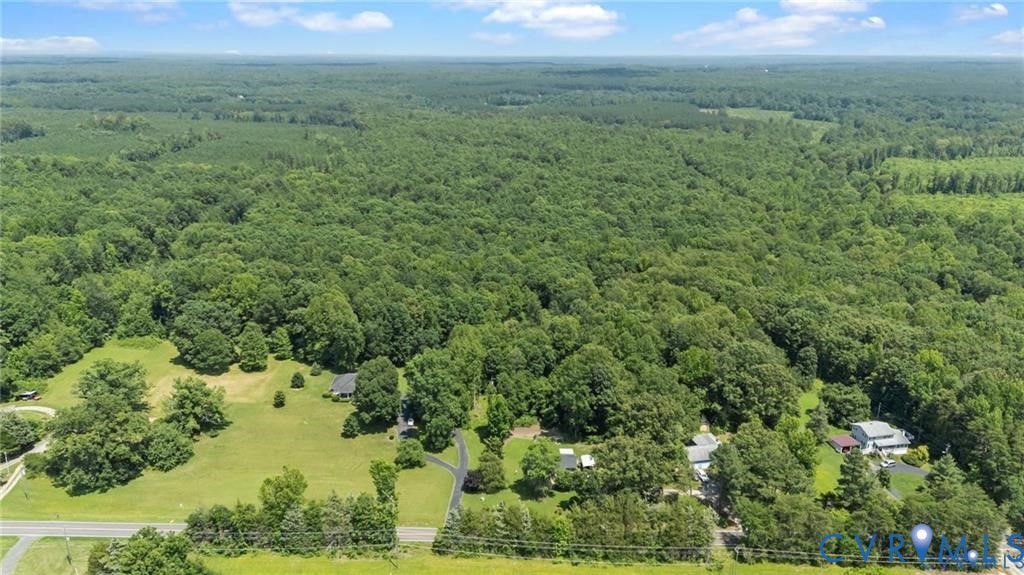 4668 Bell Road Powhatan, VA 23139 - Photo 10 of 11 a view of a field of grass and trees