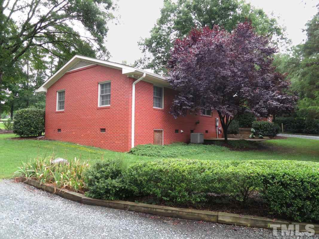 312 Davie Road Carrboro, NC 27510 - Photo 14 of 14 a front view of a house with garden
