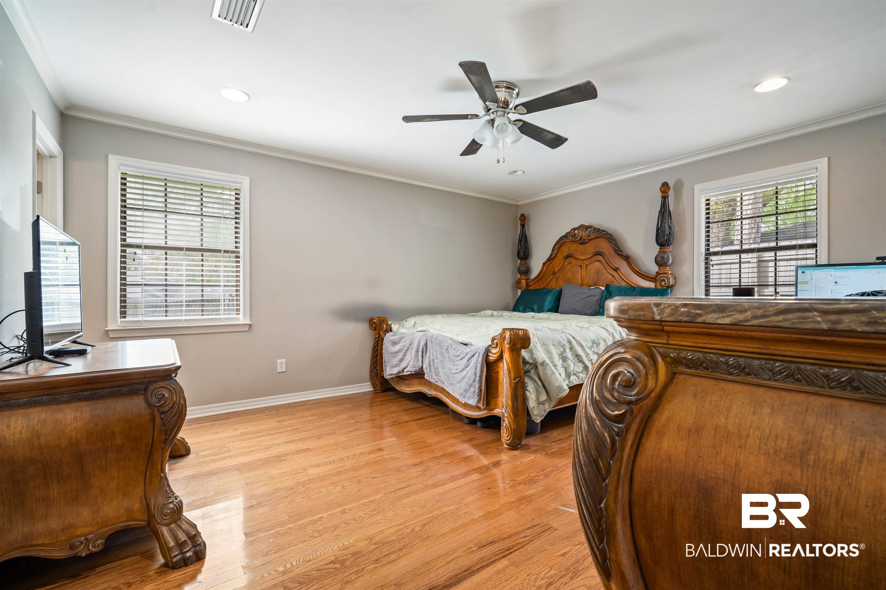 627 Spanish Main Spanish Fort, AL 36527 - Photo 13 of 39 Bedroom featuring visible vents, crown molding, baseboards, recessed lighting, and light wood-type flooring