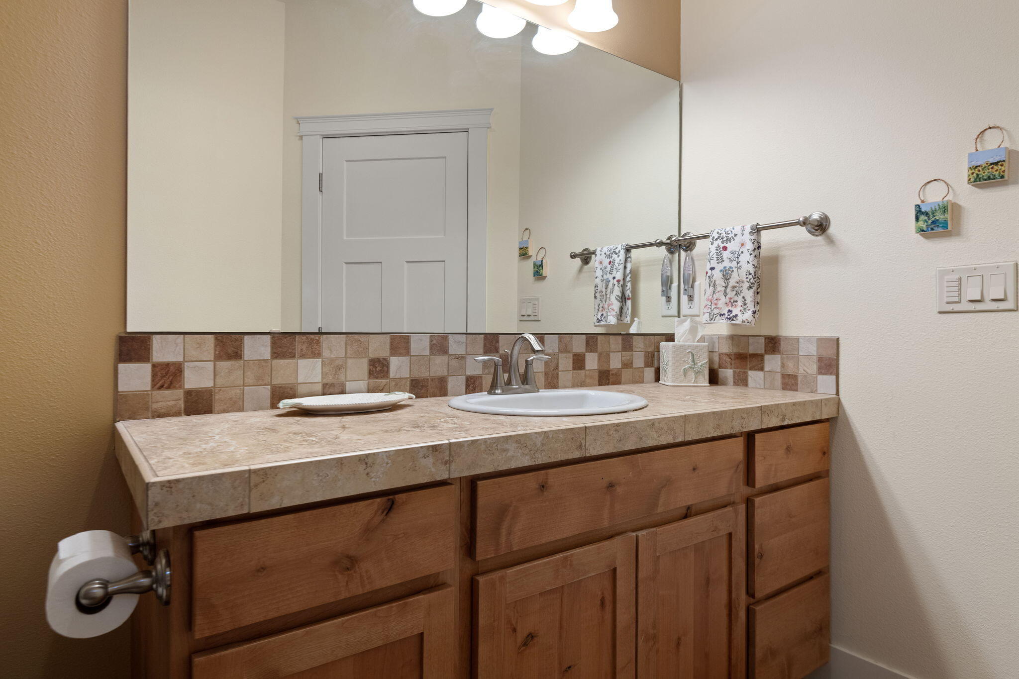62944 Fresca Street Bend, OR 97703 - Photo 10 of 32 a bathroom with a sink vanity and mirror