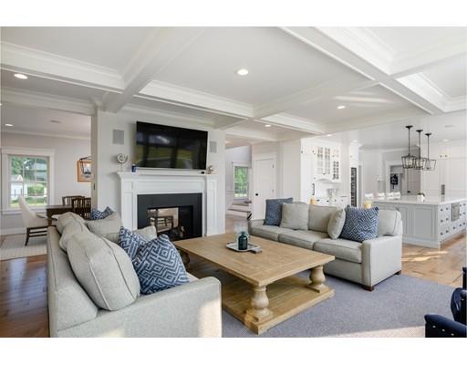 25 Bayberry Road Scituate, MA 02066 - Photo 12 of 28 a living room with furniture a flat screen tv and a fireplace