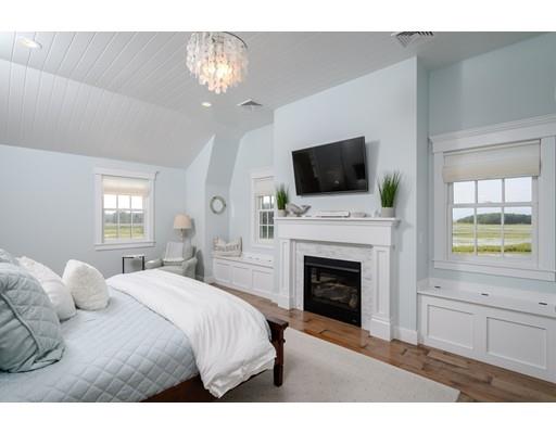 25 Bayberry Road Scituate, MA 02066 - Photo 17 of 28 a bedroom with a bed and a flat screen tv