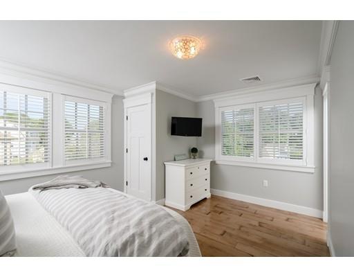 25 Bayberry Road Scituate, MA 02066 - Photo 22 of 28 a living room with flat screen tv and a window
