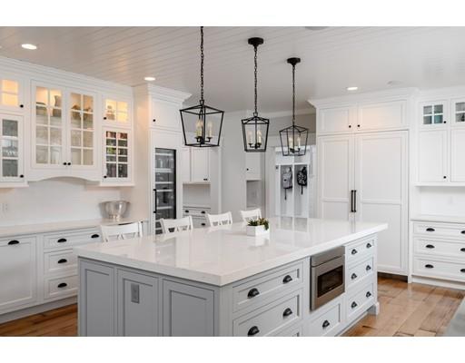 25 Bayberry Road Scituate, MA 02066 - Photo 8 of 28 a kitchen with a sink stove and cabinets