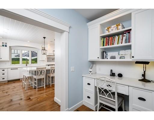 25 Bayberry Road Scituate, MA 02066 - Photo 9 of 28 a kitchen with stainless steel appliances kitchen island granite countertop a table and chairs in it