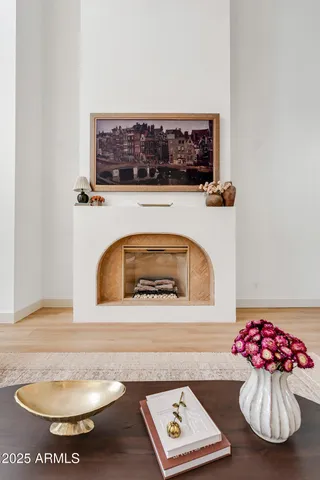a living room with furniture a rug and a flat screen tv