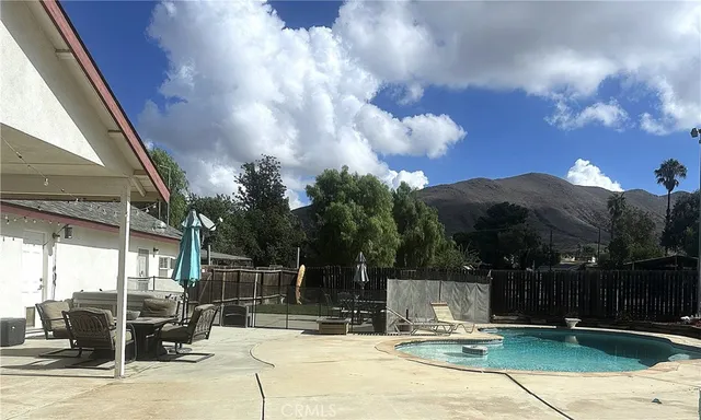 a view of a swimming pool with a patio