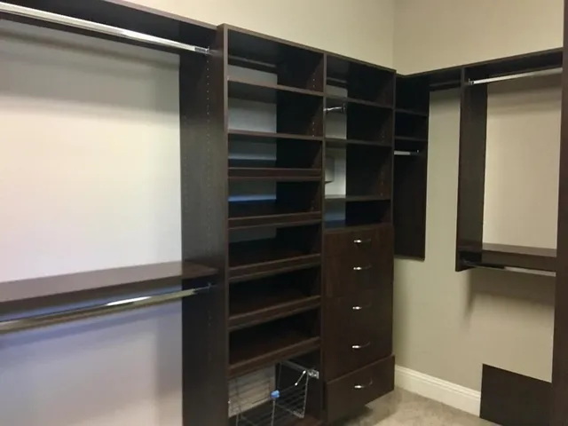 a bathroom with a granite countertop sink mirror and shower