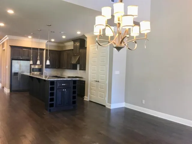 a kitchen with a refrigerator and a sink