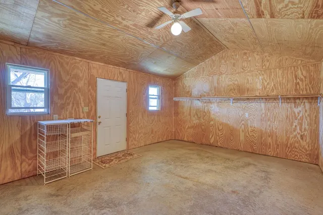 a view of building with large trees