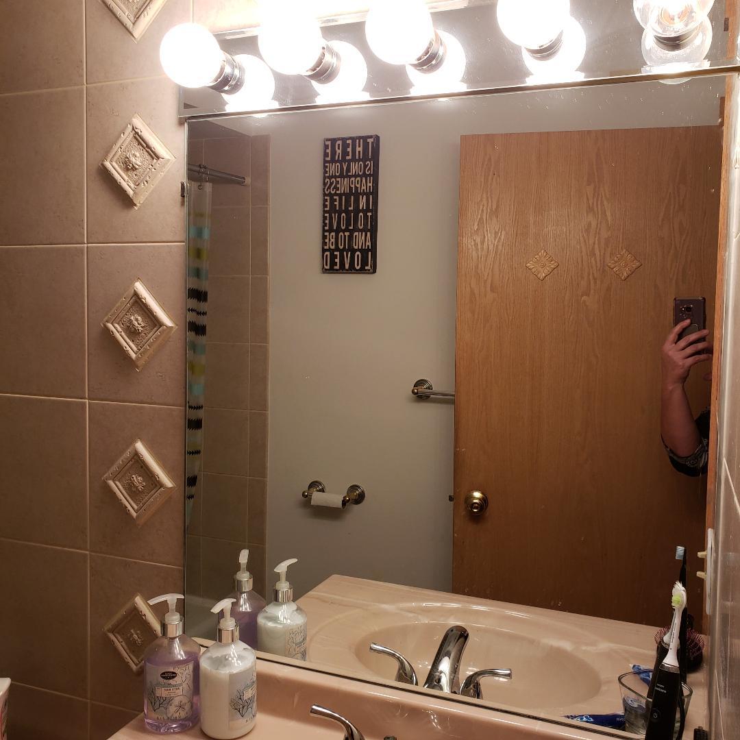 912 South Plum Grove Road, Unit 122 Palatine, IL 60067 - Photo 16 of 18 a bathroom with a sink and a shower