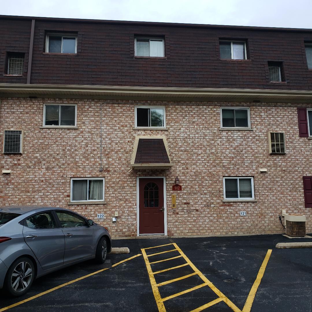 912 South Plum Grove Road, Unit 122 Palatine, IL 60067 - Photo 7 of 18 a view of a car parked in front of a building