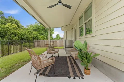 a view of a chairs and table in the patio