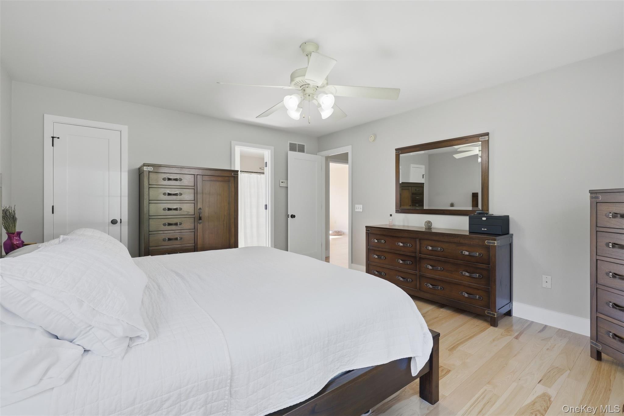 233 Devon Farms Road Stormville, NY 12582 - Photo 27 of 48 a bedroom with a bed and a dresser