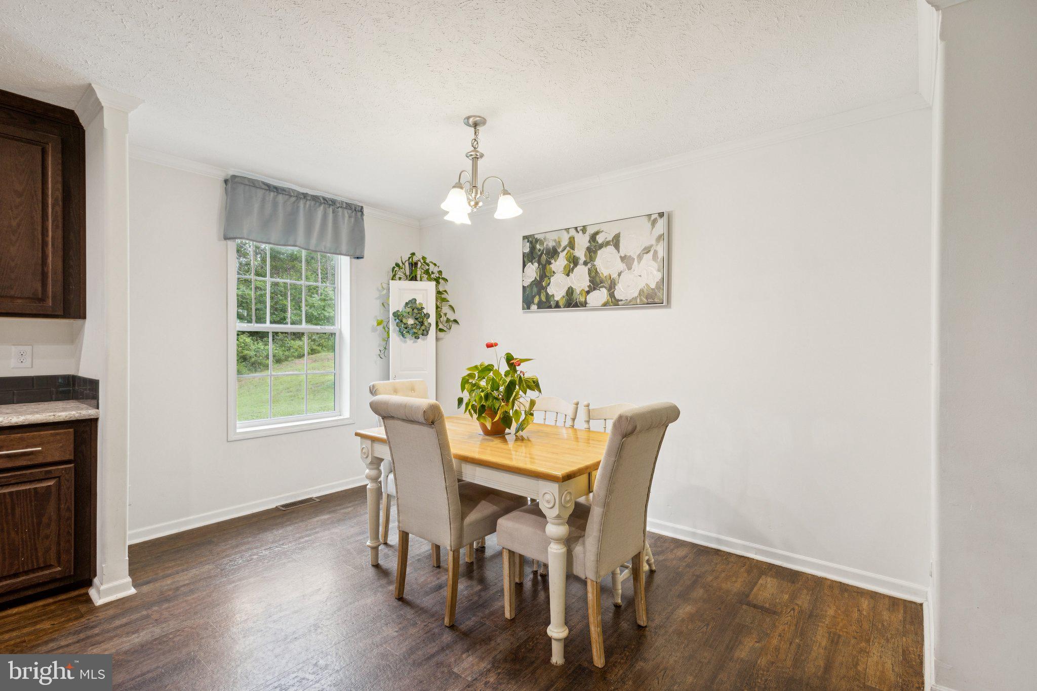 13153 Stonehouse Mountain Road Culpeper, VA 22701 - Photo 12 of 45 a dining room with furniture and window