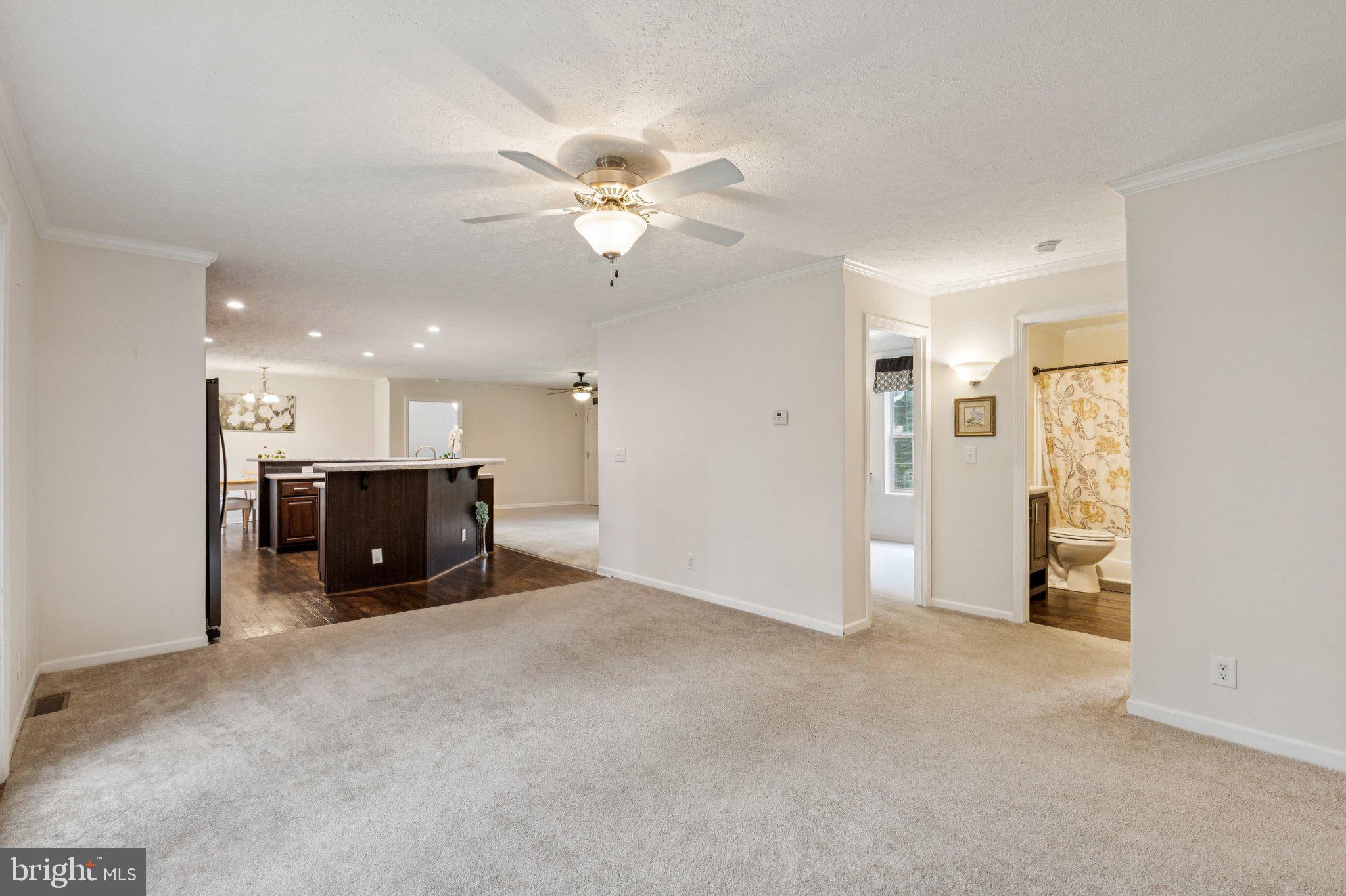 13153 Stonehouse Mountain Road Culpeper, VA 22701 - Photo 14 of 45 a view of a kitchen with a sink and a refrigerator cabinets