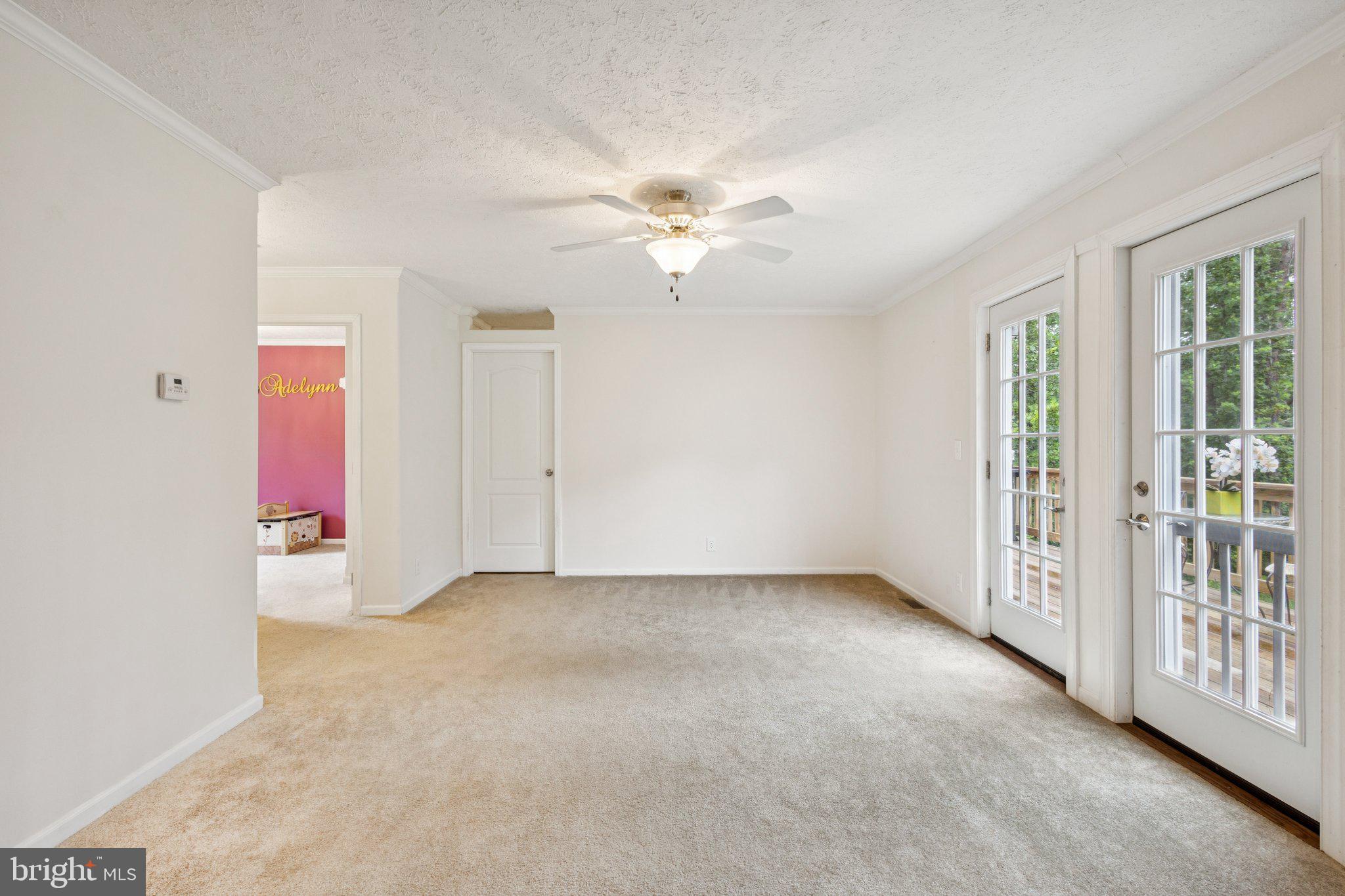 13153 Stonehouse Mountain Road Culpeper, VA 22701 - Photo 16 of 45 wooden floor in an empty room with a window