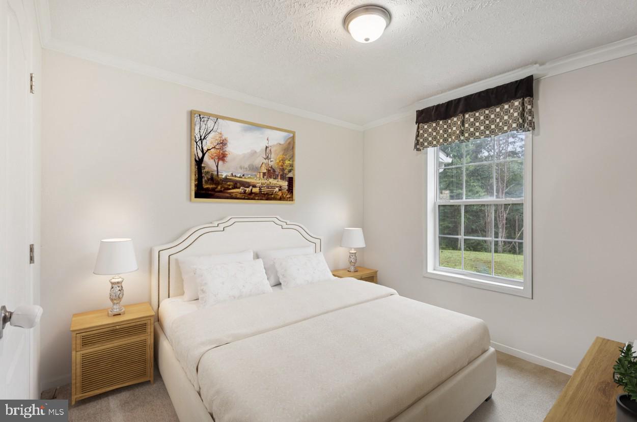 13153 Stonehouse Mountain Road Culpeper, VA 22701 - Photo 22 of 45 a bedroom with a bed and a window