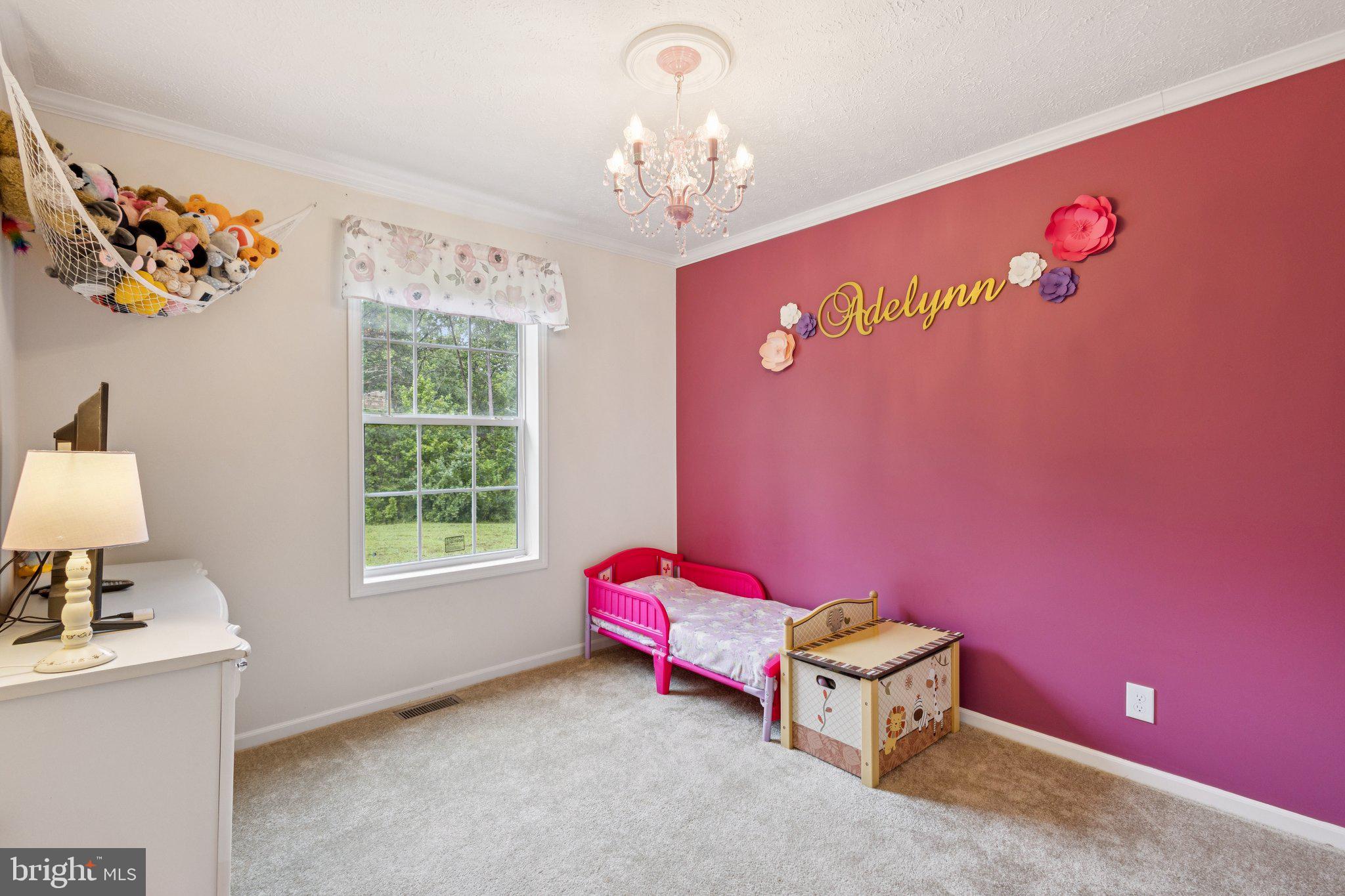 13153 Stonehouse Mountain Road Culpeper, VA 22701 - Photo 26 of 45 a living room with furniture and a window