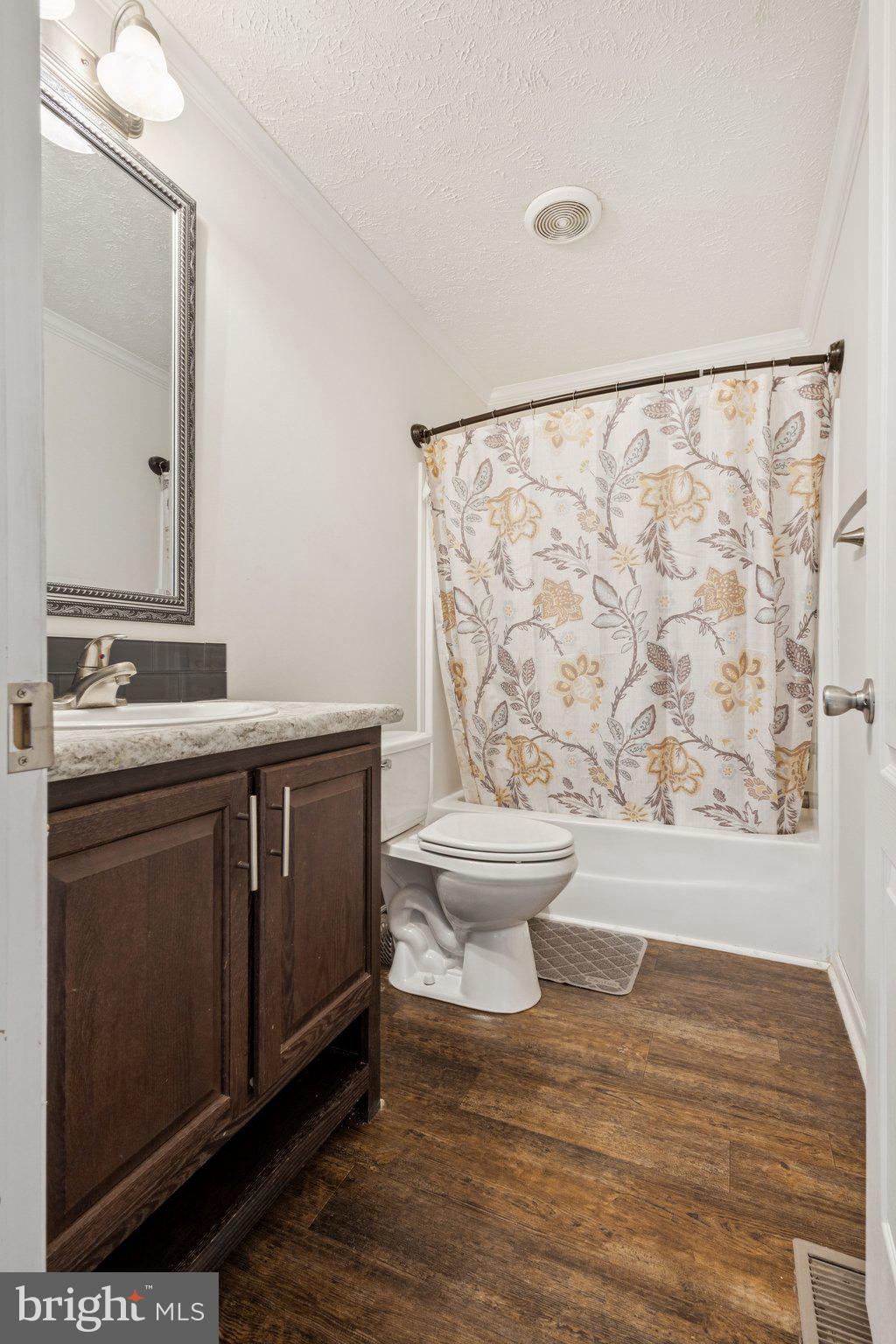 13153 Stonehouse Mountain Road Culpeper, VA 22701 - Photo 28 of 45 a bathroom with a sink toilet and shower