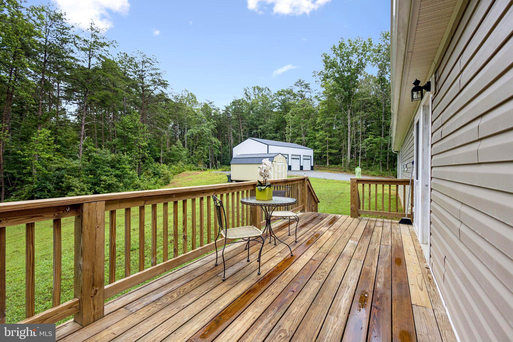 13153 Stonehouse Mountain Road Culpeper, VA 22701 - Photo 31 of 45 a view of balcony with wooden floor and fence