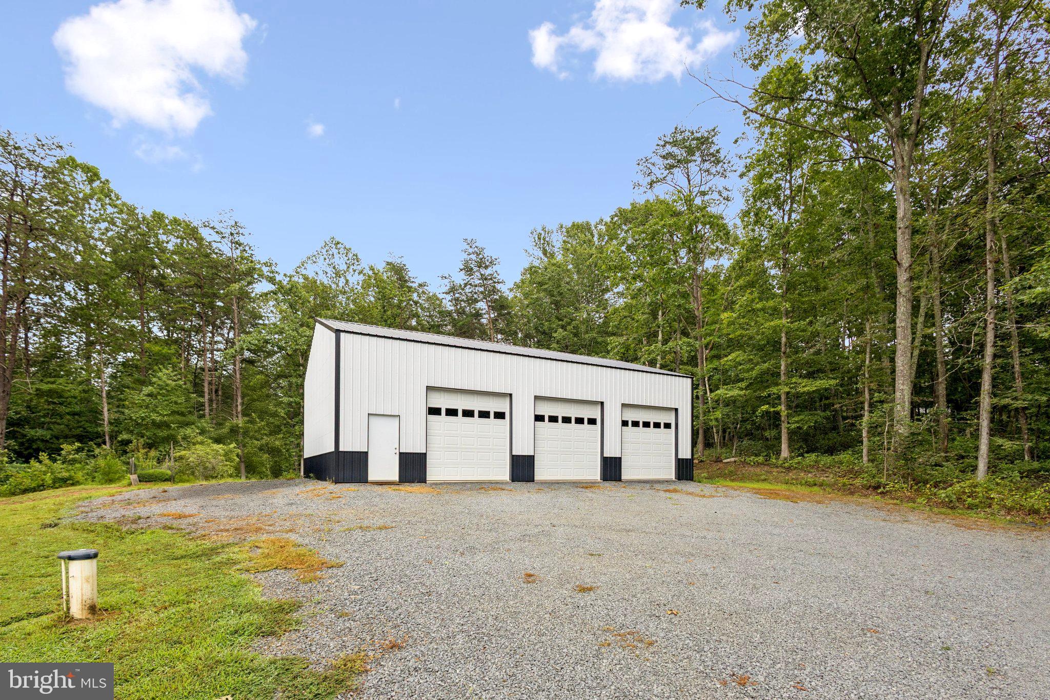 13153 Stonehouse Mountain Road Culpeper, VA 22701 - Photo 33 of 45 a view of a house with backyard and trees