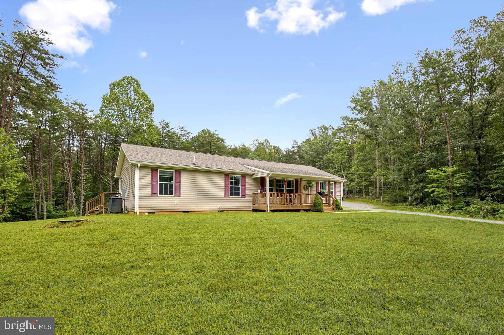 13153 Stonehouse Mountain Road Culpeper, VA 22701 - Photo 37 of 45 a view of a house with a yard