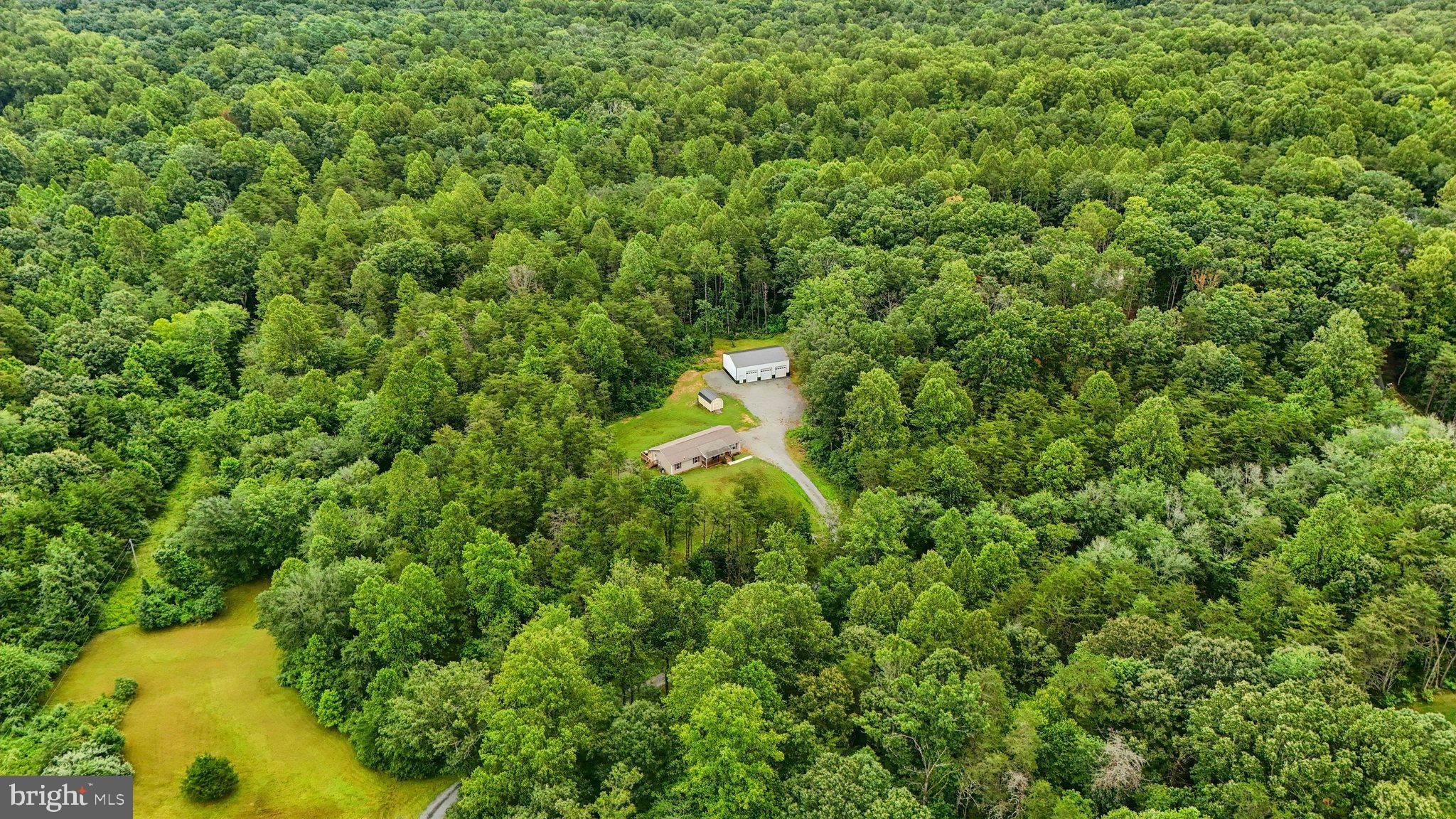 13153 Stonehouse Mountain Road Culpeper, VA 22701 - Photo 41 of 45 a map view of a house with a lush green forest