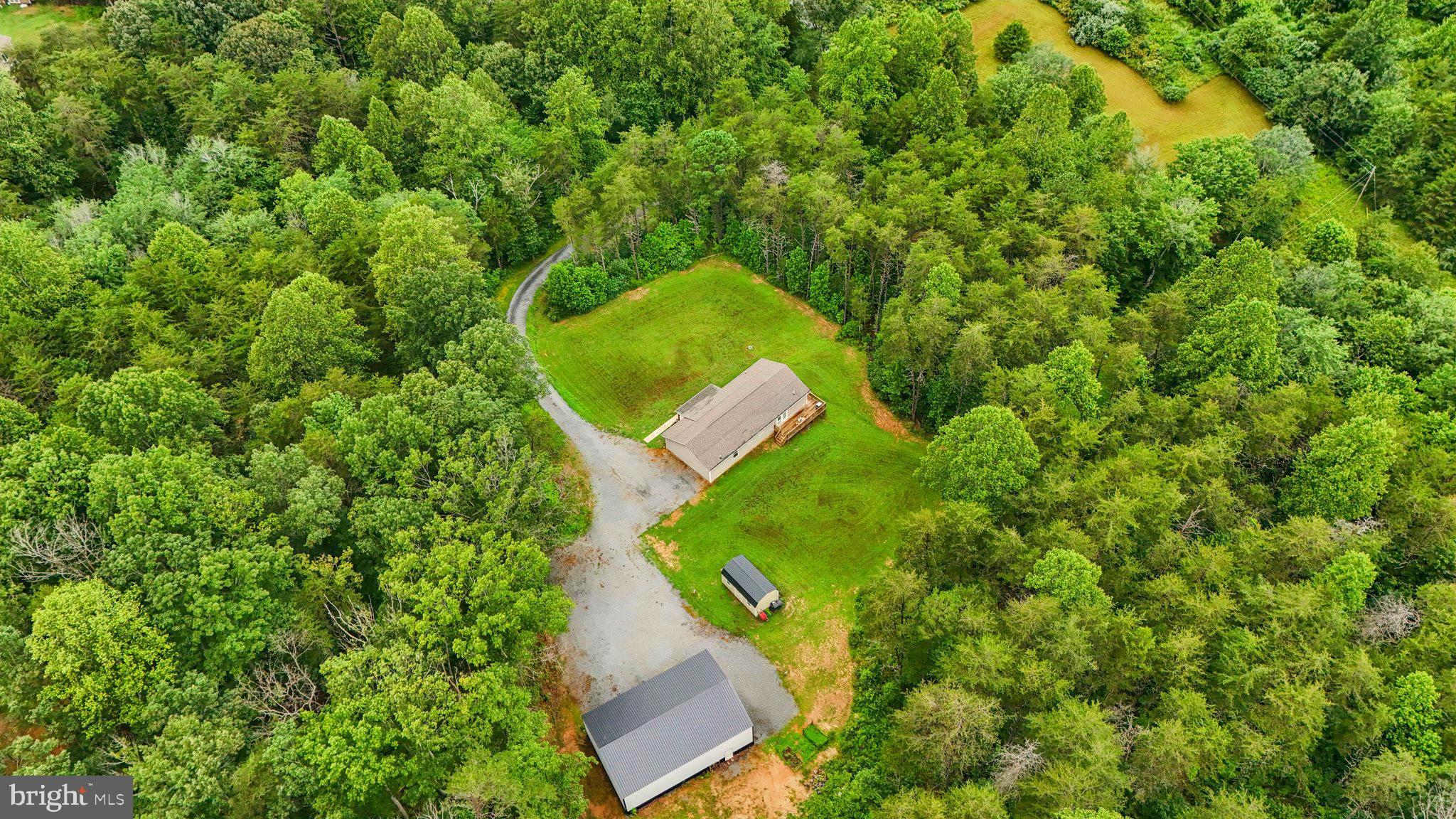 13153 Stonehouse Mountain Road Culpeper, VA 22701 - Photo 42 of 45 an aerial view of a house with a yard